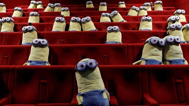 Minions toys are seen on cinema chairs to maintain social distancing between spectators at a MK2 cinema in Paris
