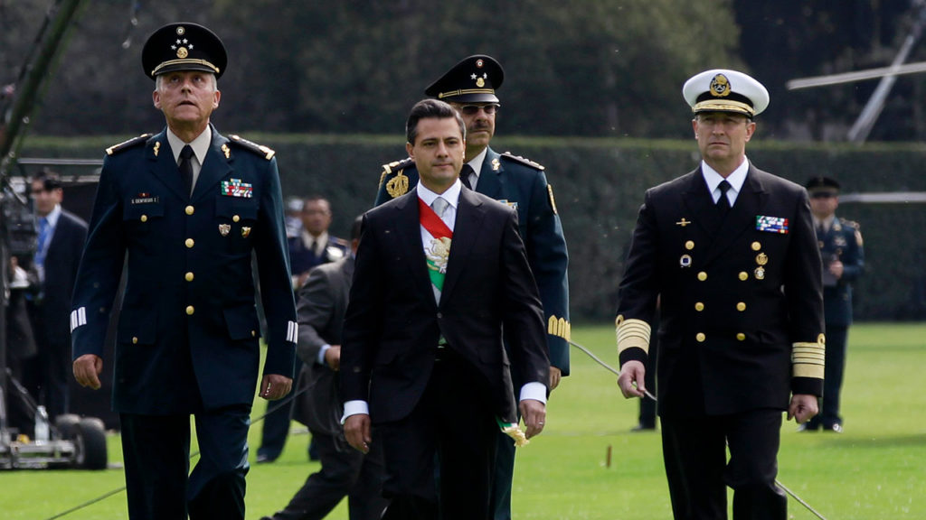 Mexico's new President Peña Nieto walks with Mexico's Defense Minister General Cienfuegos, General Miranda, who is in charge of Pena Nieto's security and Secretary of the Navy Admiral Soberon in Mexico City