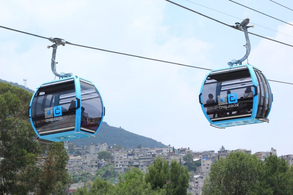 A network of cable cars is woven over the Valley of Mexico