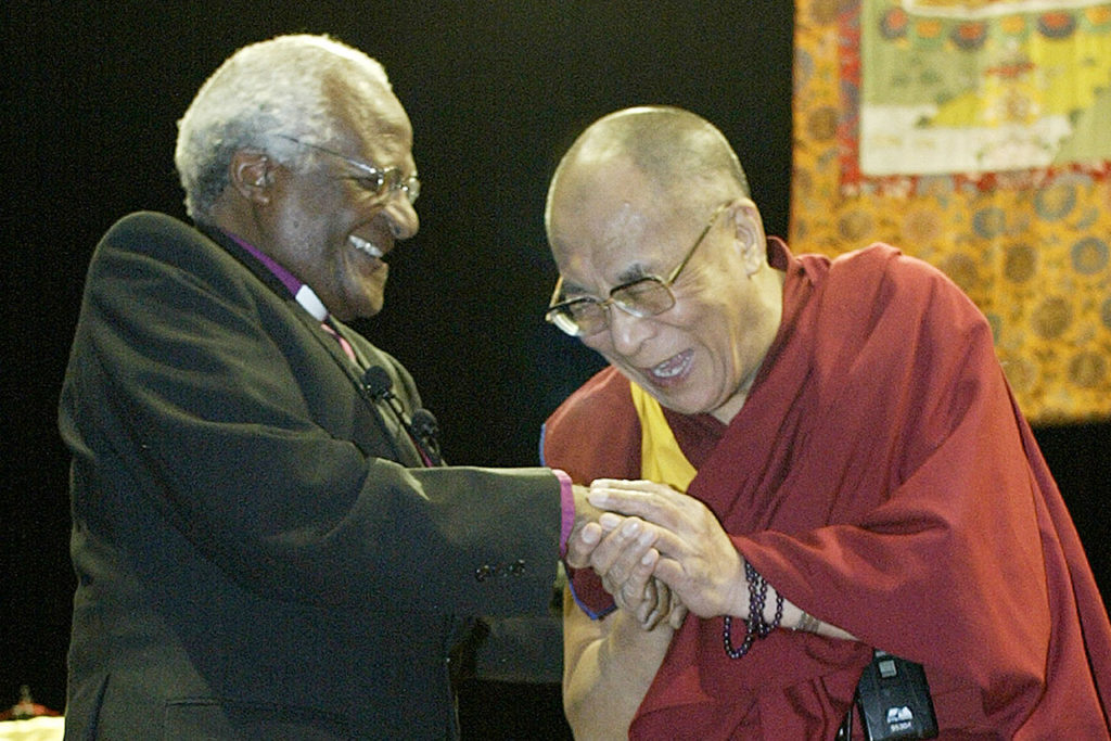 The Dalai Lama greets Archbishop Desmond Tutu in Vancouver.