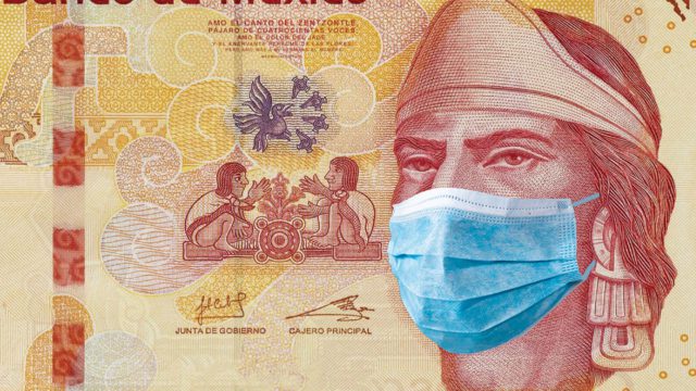 Mexico coronavirus. Banknote of 100 mexican pesos with medical mask.