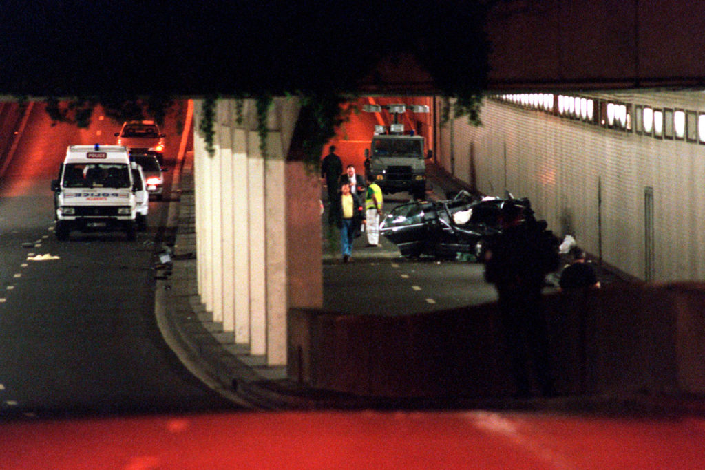 Police remove the crumpled wreck of the Mercedez-Benz which was carrying Princess Diana in Paris