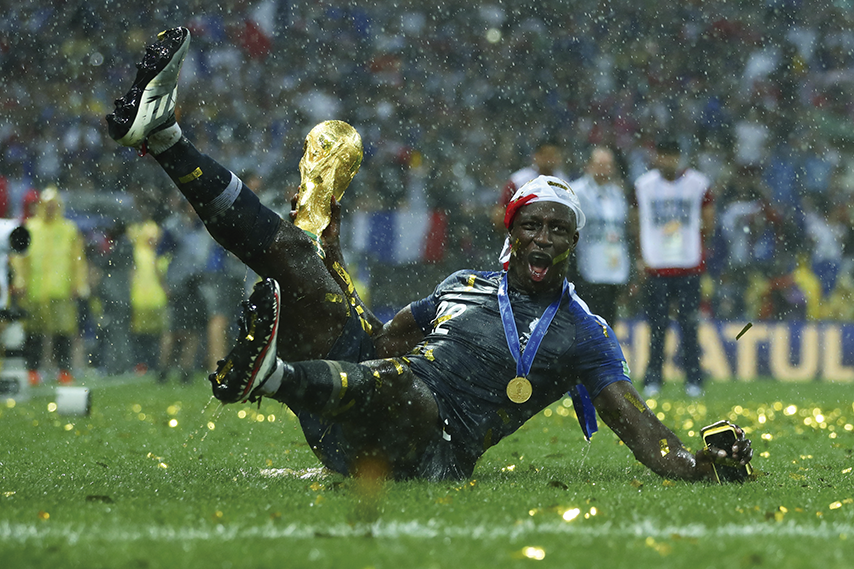 MOSCOW, RUSSIA - JULY 15: Benjamin Mendy of France celebrates victory with the World Cup trophy following the 2018 FIFA World Cup Final between France and Croatia at Luzhniki Stadium on July 15, 2018 in Moscow, Russia. (Photo by Lars Baron - FIFA/FIFA via Getty Images)
